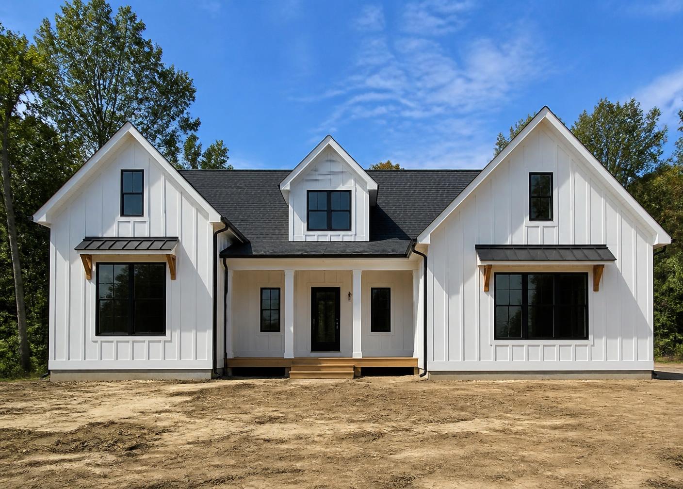Front of a new construction white board-and-batten home painted by George Harper Painting